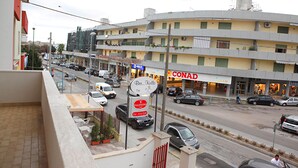 A multi-story building with a visible storefront named "CONAD." - Le Stanze di Lucia (Tricase)