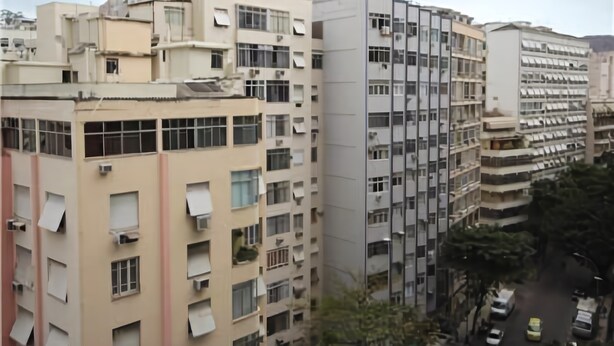 A multi-story residential building with balconies and air conditioning units. - GoHouse Vergueiro 901 (Rio de Janeiro)