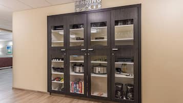 A kitchenette with a sign above indicating it's a 'Lending Locker.'