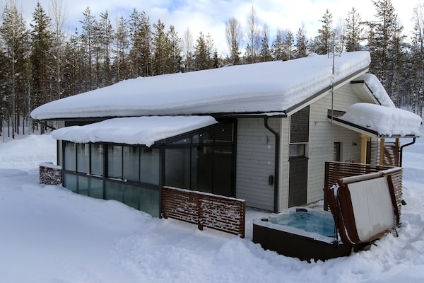House from the backyard, hot tub, glass terrace
