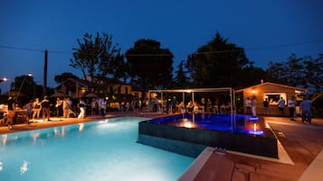 Seasonal outdoor pool, open 8:30 AM to 8:00 PM, pool umbrellas