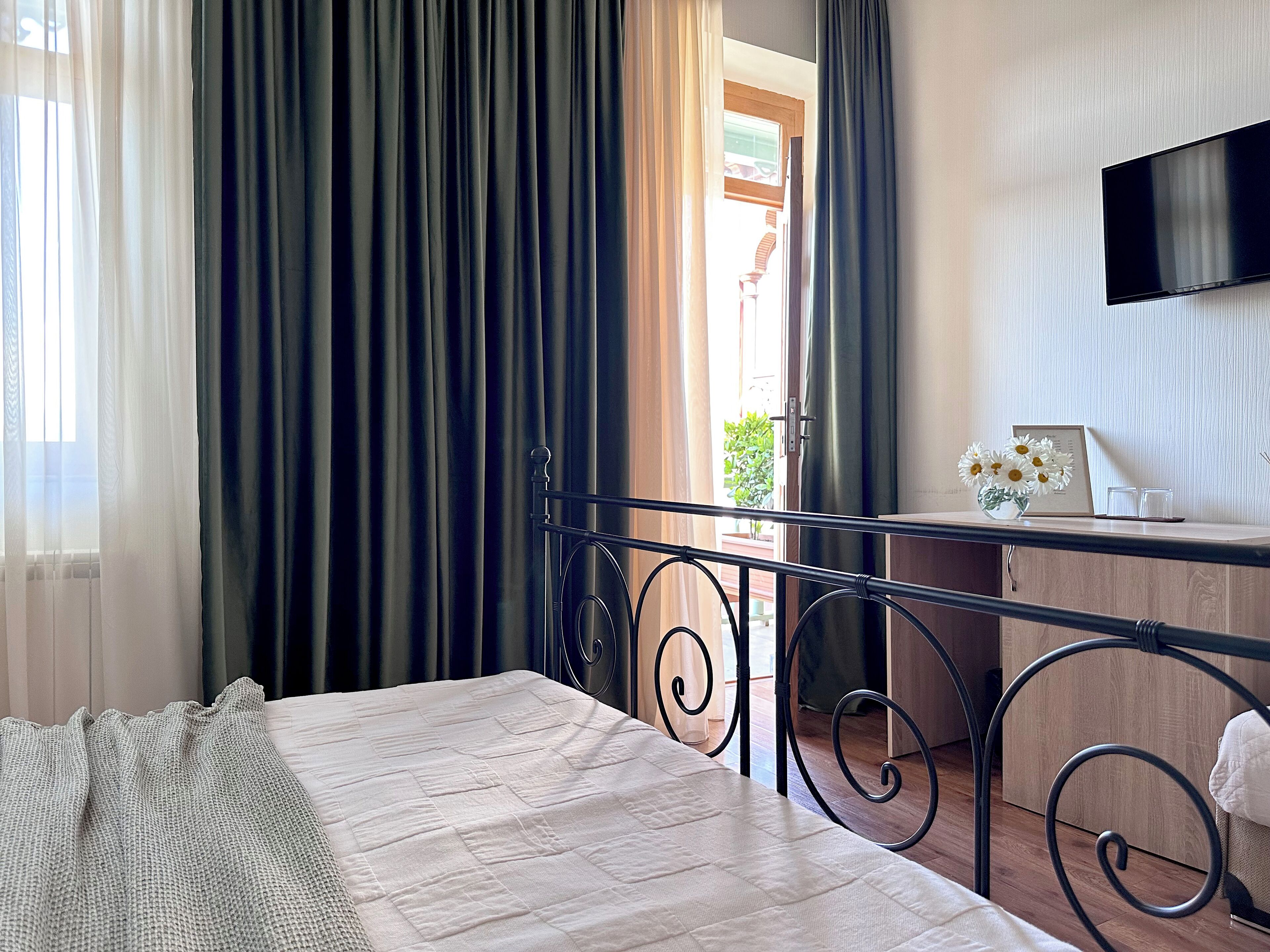 economy double room | premium bedding, minibar, in-room safe, blackout curtains