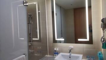 Shower, hair dryer, slippers, towels