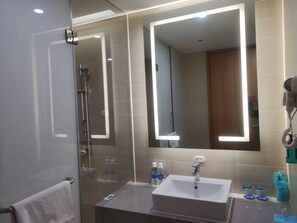 Shower, hair dryer, slippers, towels