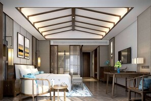 A modern hotel room with a large bed, a sitting area with a small table, and a dining area with a wooden table and chairs. - Wyndham Guilin Pingle (Guilin)
