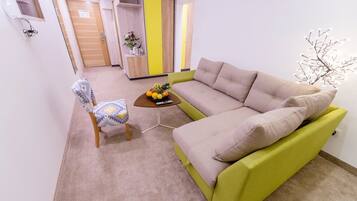 Apartment, 1 Bedroom | Living area | Flat-screen TV