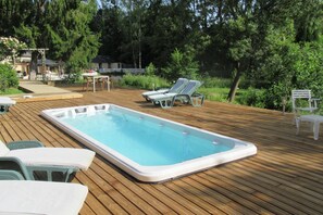 Outdoor pool, open 9:00 AM to 10:00 PM, pool loungers