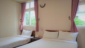 A hotel room with two single beds, a nightstand, a window with curtains, and a wall-mounted clock. - Rich Zone Hotel (Taipei)