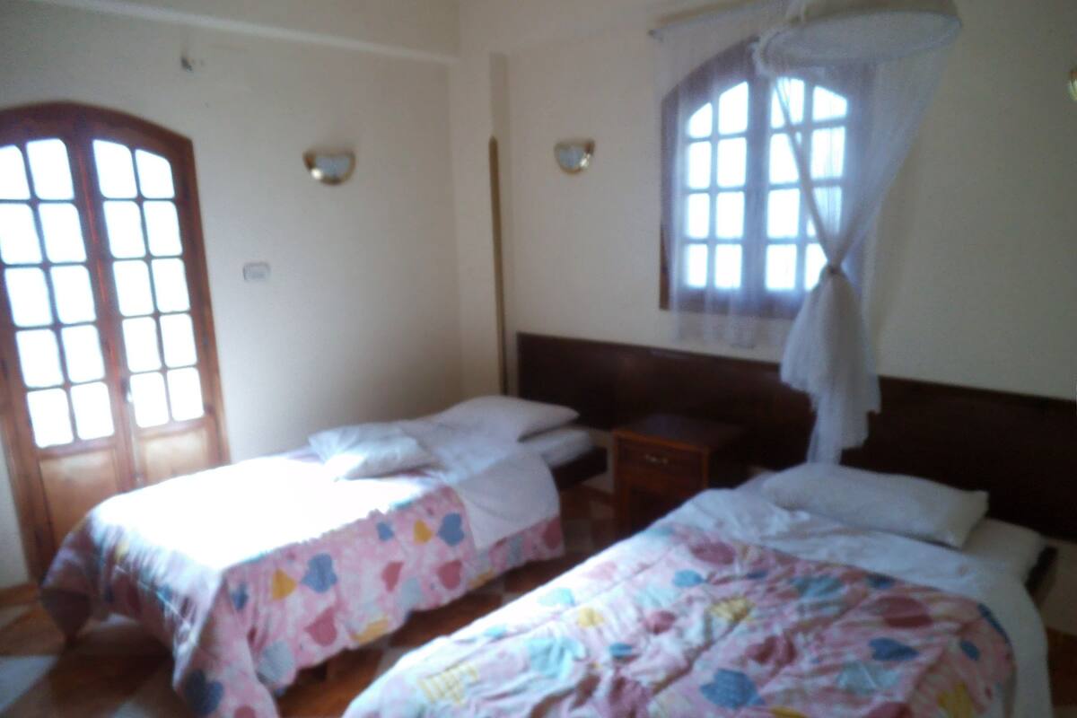 Twin Room, Shared Bathroom | Iron/ironing board, rollaway beds (surcharge), WiFi (free)