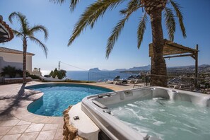 Relax by the ocean with a swim in the pool or unwind in the hot tub surrounded by palm trees.