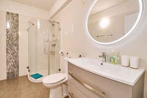 Shower, hair dryer, towels, soap
