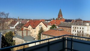 A view of a town with buildings and a prominent church tower. - Apartment I. First floor 82sqm, 2 bedrooms with balcony - Old Fire Station Görlitz City (Görlitz)