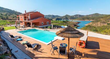Luxurious villa with pool and idyllic lake landscape