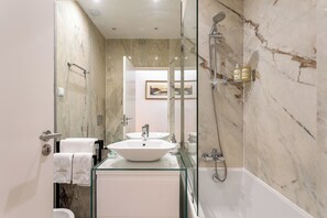 Combined shower/tub, hair dryer, bathrobes, bidet