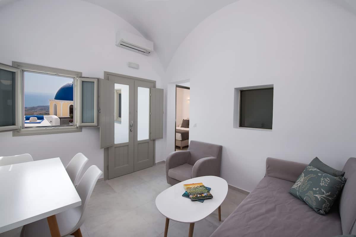 Suite, 2 Bedrooms, Partial Sea View | Living room | 32-inch flat-screen TV with cable channels, TV