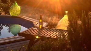A wooden deck with a swimming pool, surrounded by greenery and hills. - A luxury escape in Chianti, great landscape, stunning views, swimming pool (San Polo in Chianti)