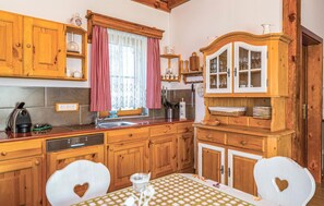 Fridge, stovetop, dishwasher, coffee/tea maker