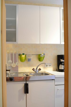 Fridge, coffee/tea maker, electric kettle, toaster