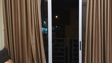 Villa | Living room | 60-inch flat-screen TV with cable channels, TV, DVD player
