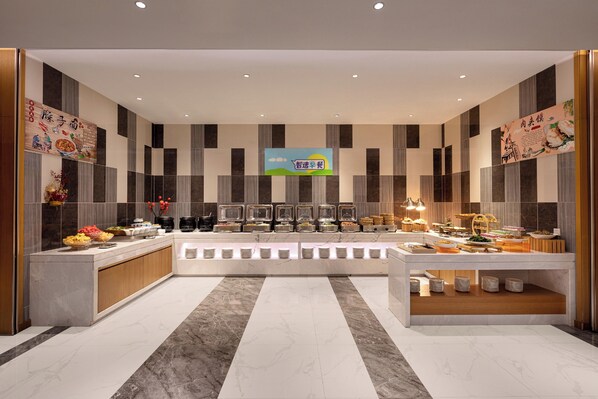 A modern buffet setup with multiple food stations and a central serving area. - Holiday Inn Express Xi'an Qujiang South by IHG (Xi'an)