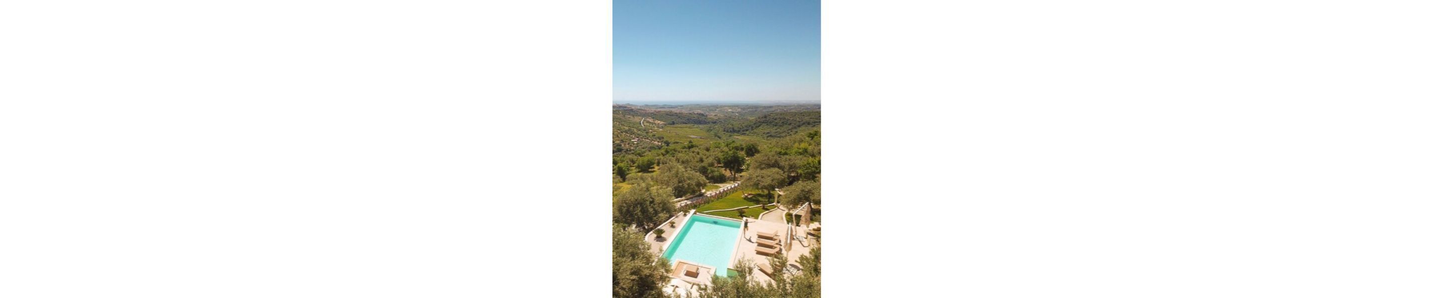 A pool with a view of a valley.