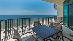 A balcony with a view of the beach and ocean. - Come RELAX on the LAZY RIVER! Phoenix West 3BR (Orange Beach)