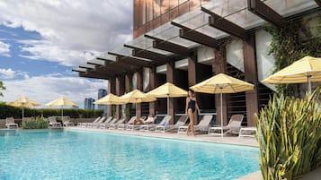 Outdoor pool, open 6 AM to 6 PM, pool umbrellas, pool loungers