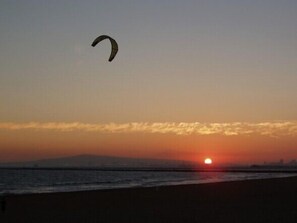 Enjoy a serene beach experience with opportunities for kite flying and relaxation.