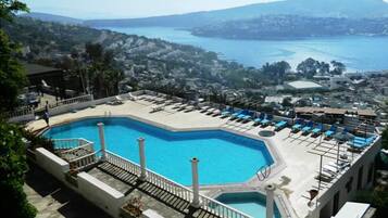 Seasonal outdoor pool, open 8 AM to 6:30 PM, pool umbrellas