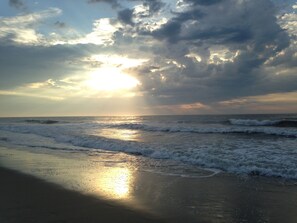On the beach, sun-loungers