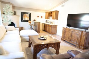Smart TV, fireplace, DVD player, books