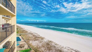 A beachfront hotel with a pool, beach access, and a view of the ocean. - Phoenix III…Gulf Front!...One bedroom (Orange Beach)