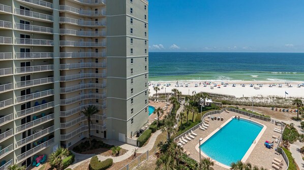 A high-rise hotel with a pool and beach view. - 2 BR @ Seaside Beach & Racquet (Orange Beach)