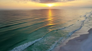 A beach with waves and a sunset. - Sea-Sun-n-Fun... (Miramar Beach)