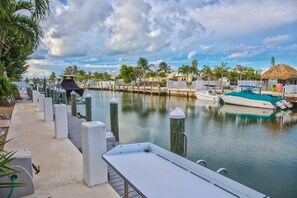 Moored boats line the marina, offering a tranquil waterfront view.