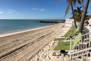 Enjoy the serene ocean views from our beachfront lounge chairs.