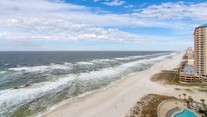 A beachfront hotel with a pool, ocean view, and a beach promenade. -  New 1BR/1BA Luxury Beachfront Vacation Rental! Sleeps 6! Near Pier Park! (Panama City Beach)