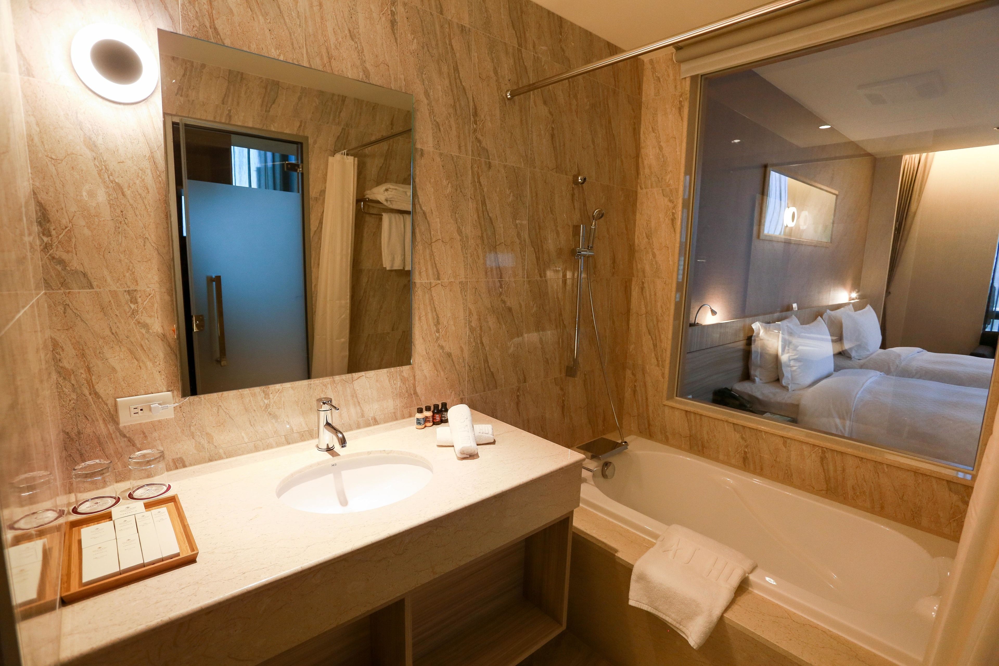 combined shower/bathtub, hair dryer, towels, soap