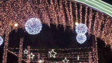 A covered outdoor area with string lights and star-shaped decorations.