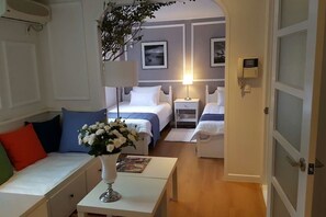 The VALENTINO Residence | Living area | 28-inch flat-screen TV with cable channels, TV