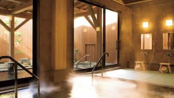 A hot spring area with a wooden interior, a glass door leading outside, and a small wooden bench.