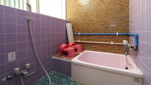 A bathroom with purple tiles, a pink bathtub, and a shower area. - Sazanamikan (Futtsu)