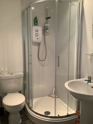 Combined shower/tub, hair dryer, towels, soap