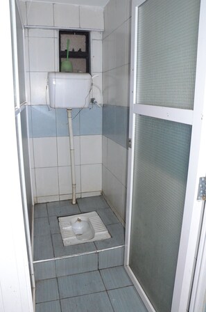 Shower, free toiletries, slippers, towels