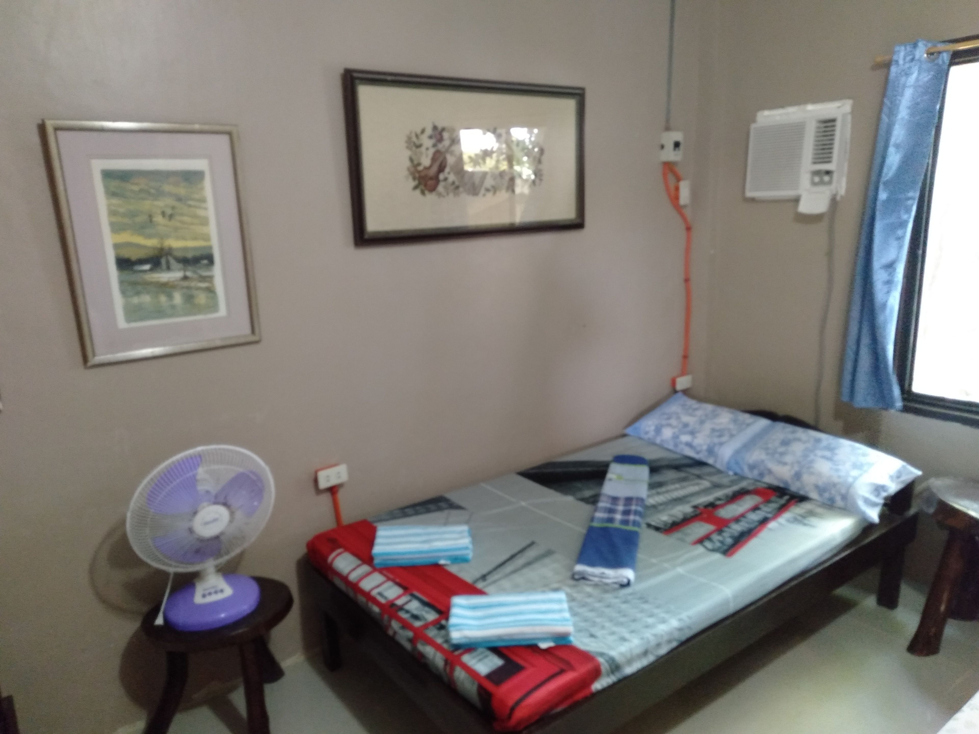 Desk, iron/ironing board, bed sheets