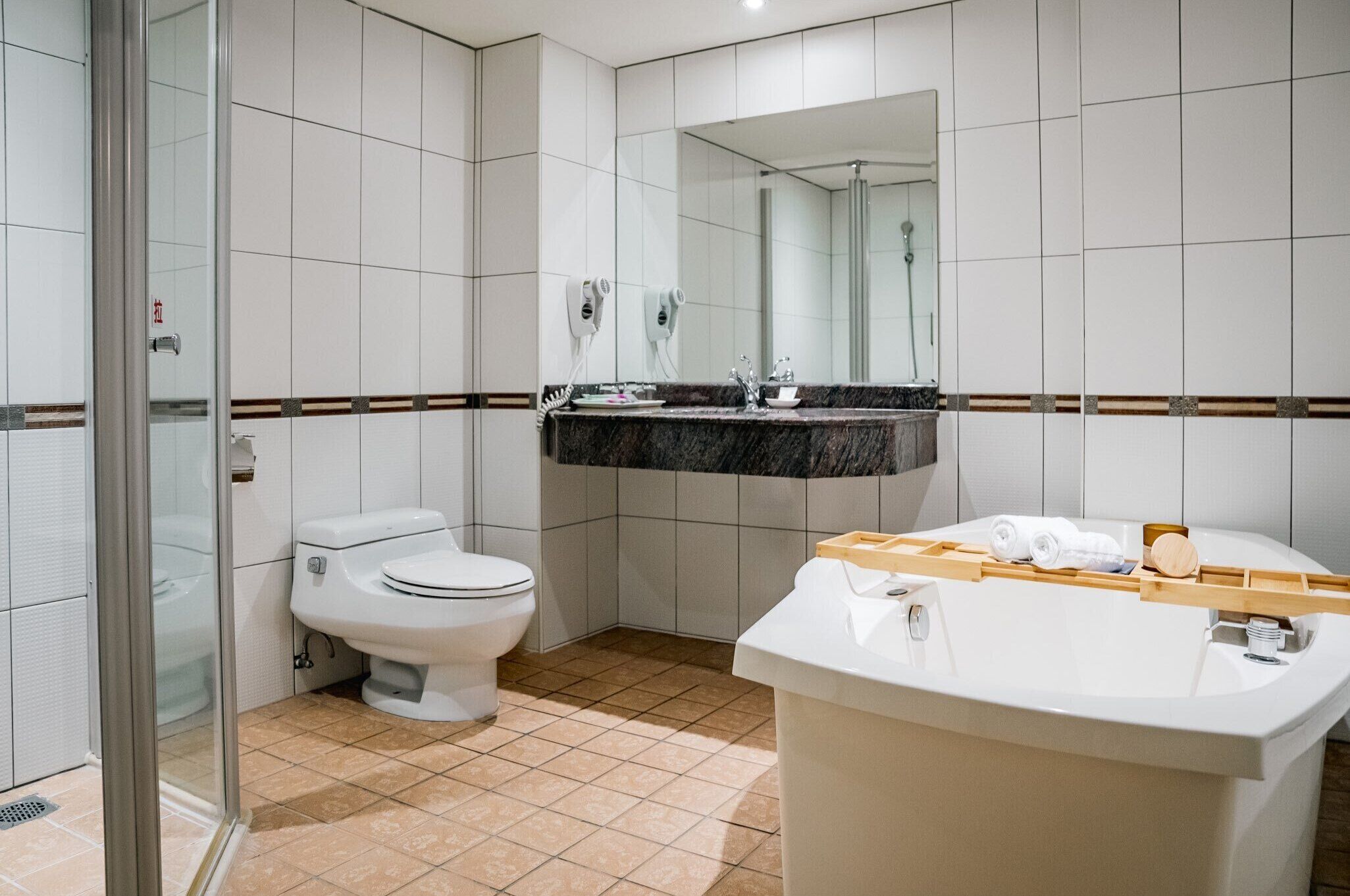 deluxe japanese style quadruple room | bathroom | rainfall showerhead, free toiletries, hair dryer, slippers