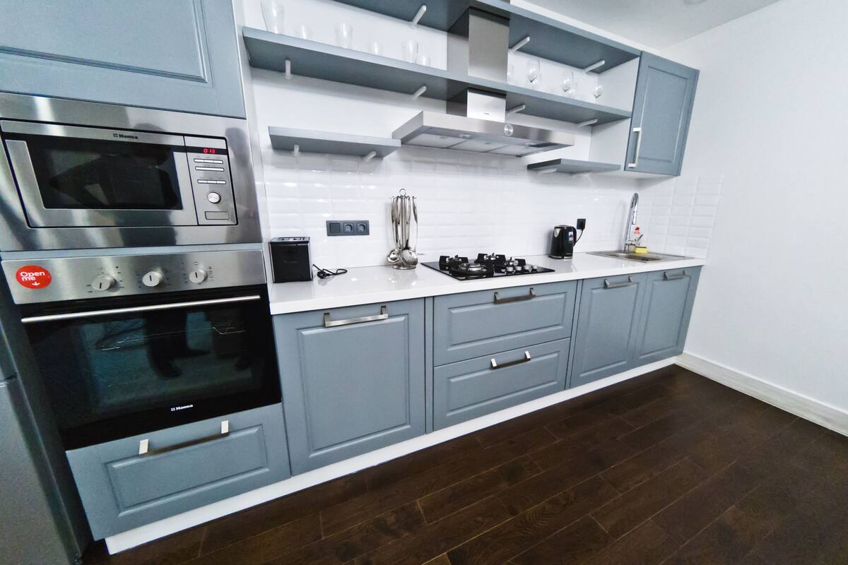 full-sized fridge, microwave, stovetop, espresso maker