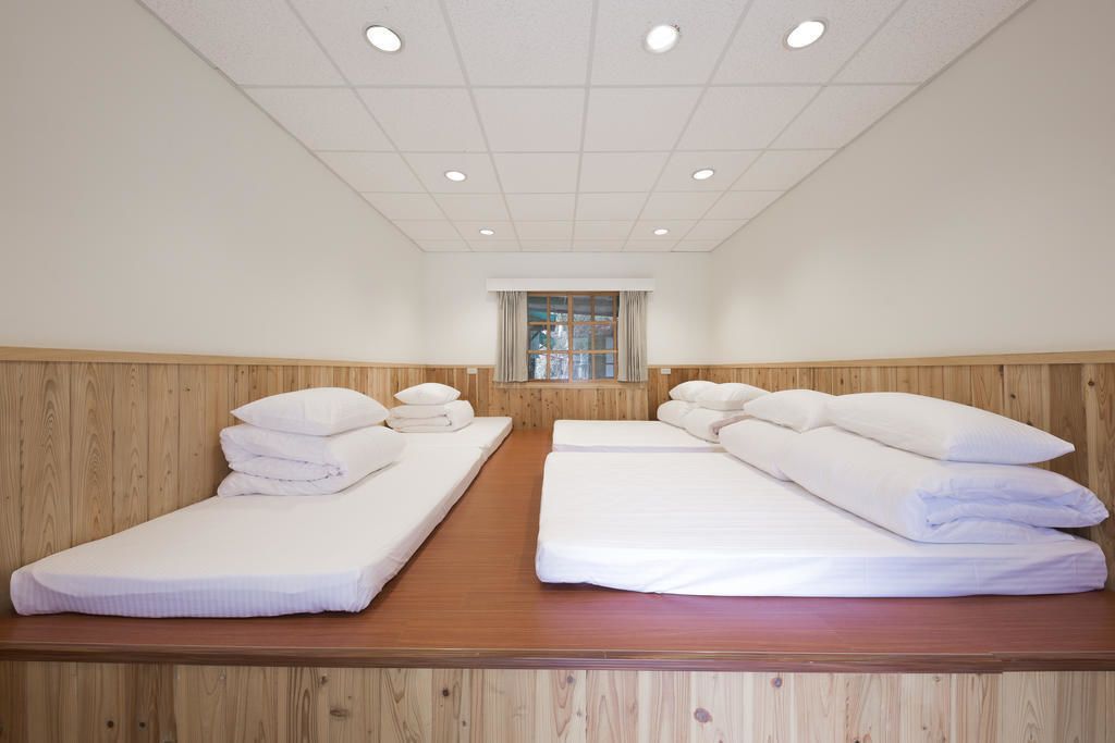 family room, multiple beds, shared bathroom | room amenity