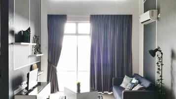 Exclusive Duplex, 3 Bedrooms | Living room | Flat-screen TV