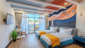 A modern hotel room with two beds, a desk, a chair, and a balcony with curtains. - Kingfisher Nest Hotel Suites-Westlands, Near Sarit Center (Nairobi)
